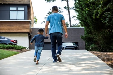 Father and son walking at home