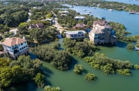 Mansions and luxury homes flooded damaged by climate change environmental disaster