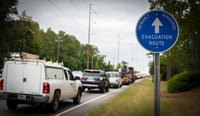 vehicles along a street marked evacuation route