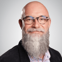 A professional headshot of JD Weisbrot
