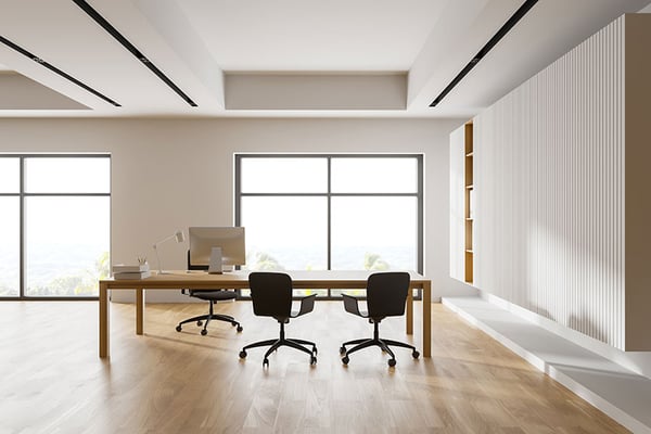 empty desk chairs in open room