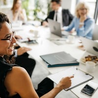 candid-close-up-of-hispanic-businesswoman-in-office-meeting-800x800-2