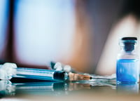 This image shows a Syringe and Vial - Representing GLP-1 Drugs Ozempic and Wegovy Mentioned in Pharmaceutical Text about Weight Loss Trends and Economic Impact on Food and Beverage Industry.